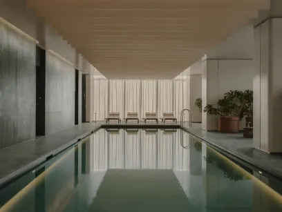 An artist 's impression of a large indoor swimming pool