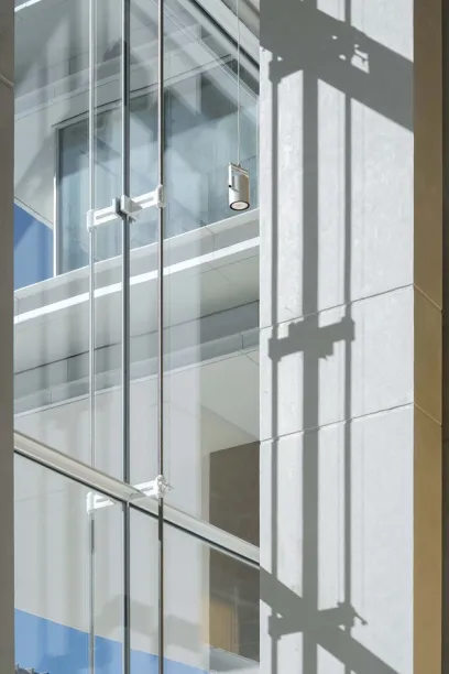 A building with a lot of windows and a reflection of the sky