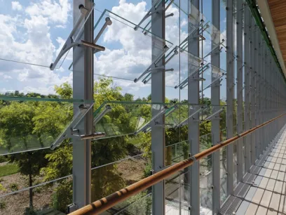 A building with a lot of windows and a wooden railing