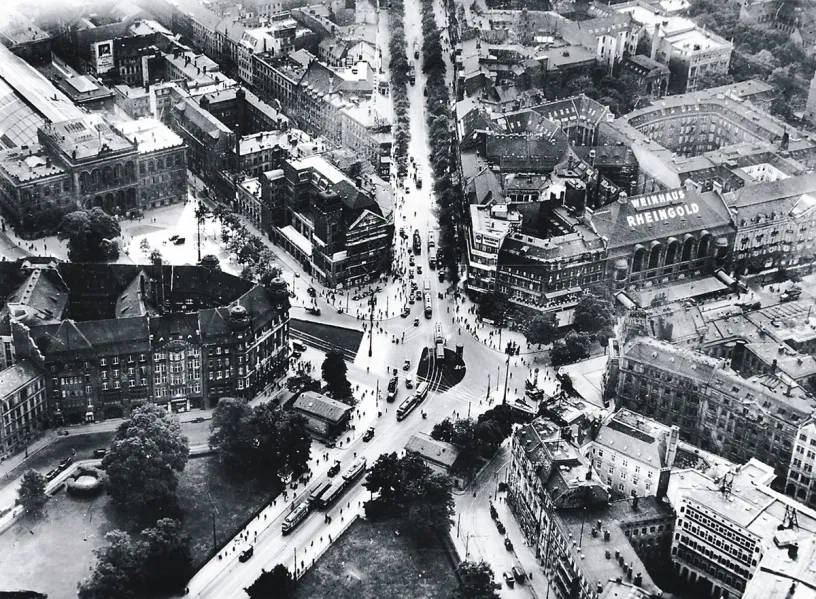 A black and white photo of an aerial view of a city