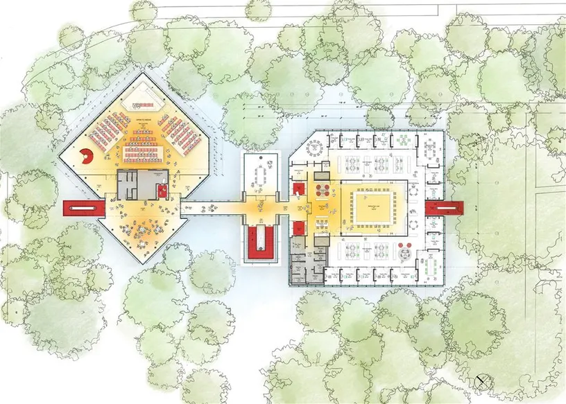 an aerial view of a floor plan of a building surrounded by trees .