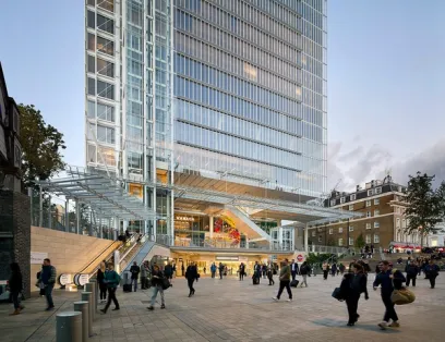 A group of people are walking in front of a tall building
