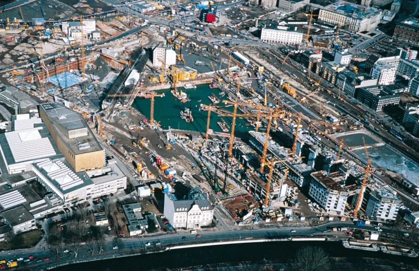 An aerial view of a large construction site in a city