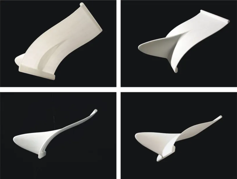 Four different angles of a white object on a black background