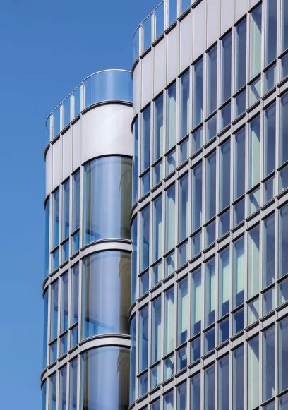 a building with a lot of windows against a blue sky