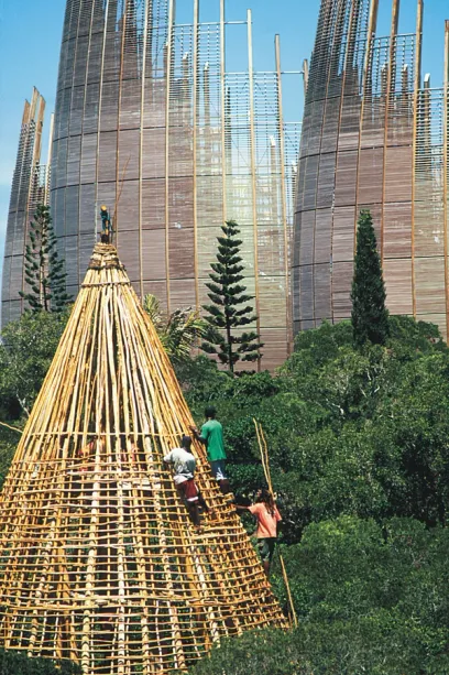A group of people are working on a wooden structure