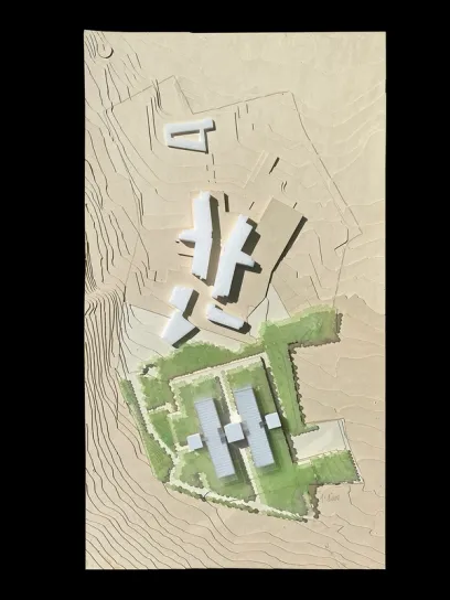 An architectural model of a house on a hillside