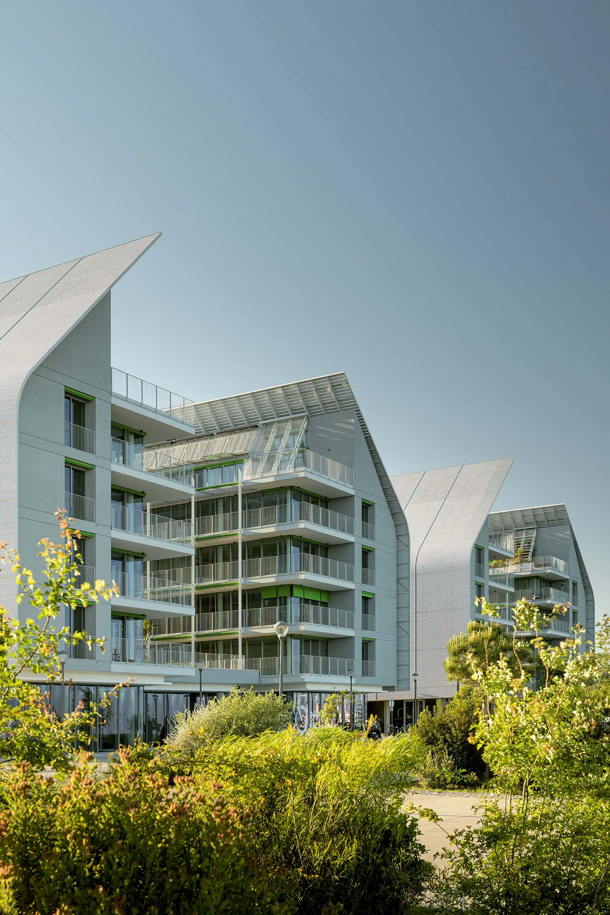 A building with a roof that has a green awning on it