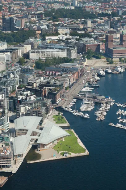 An aerial view of a city with boats in the water