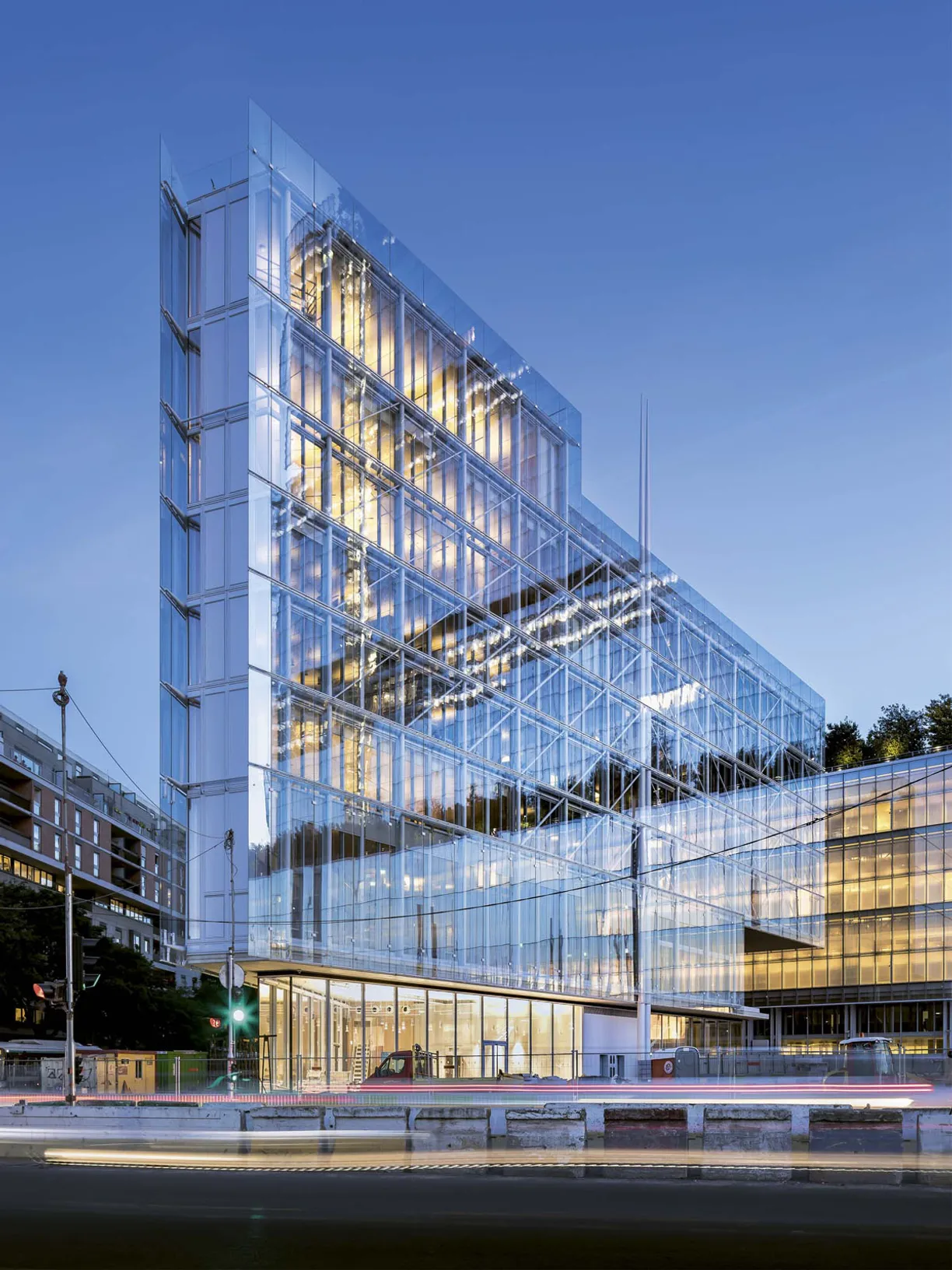a building with a lot of windows is lit up at night