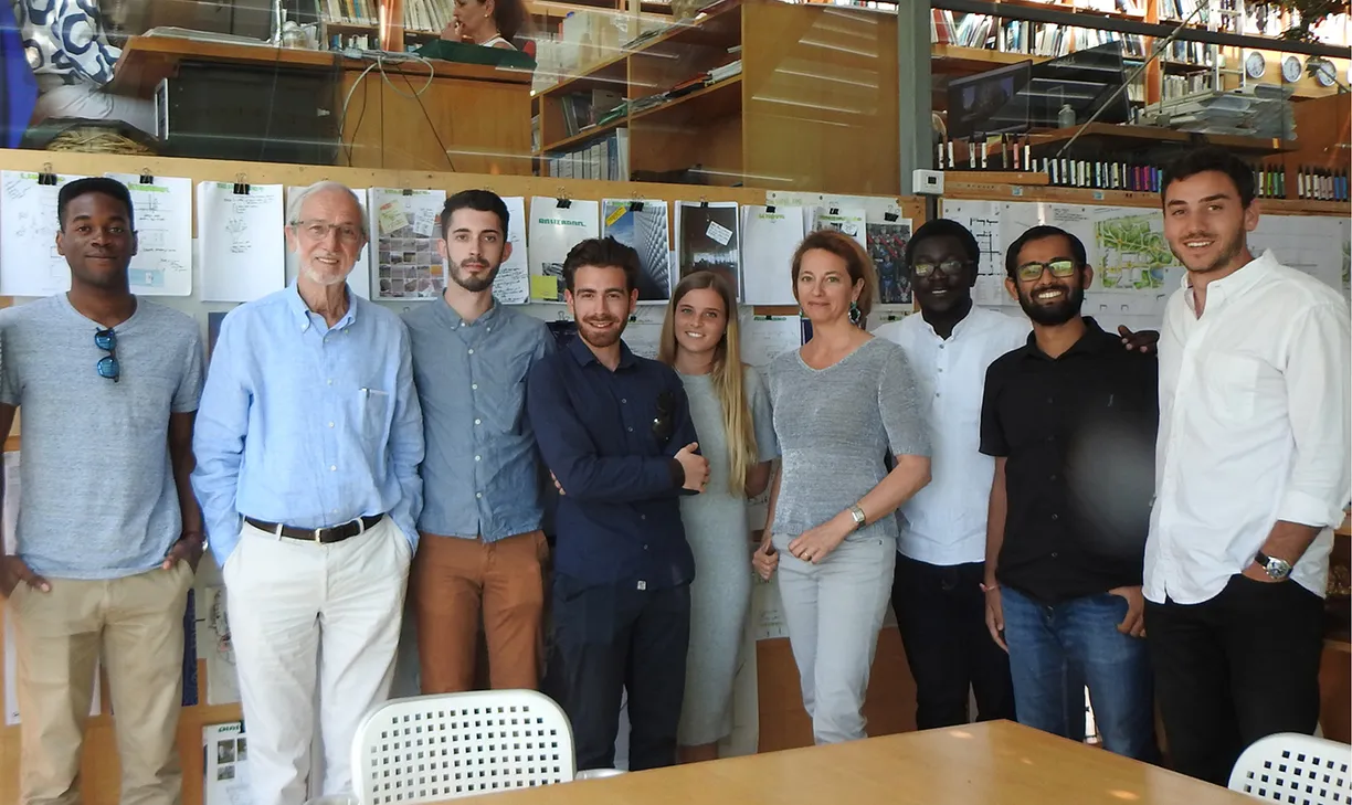 A group of people are posing for a picture in a room