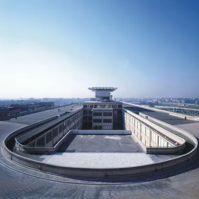 An aerial view of a large building with a circular roof