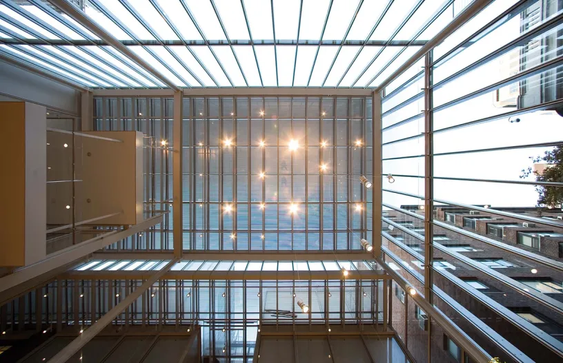 Looking up at the ceiling of a building with a lot of windows