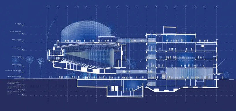 A blueprint of a large building on a blue background