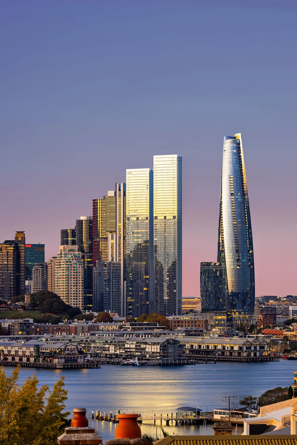 A view of a city with a large body of water in the foreground
