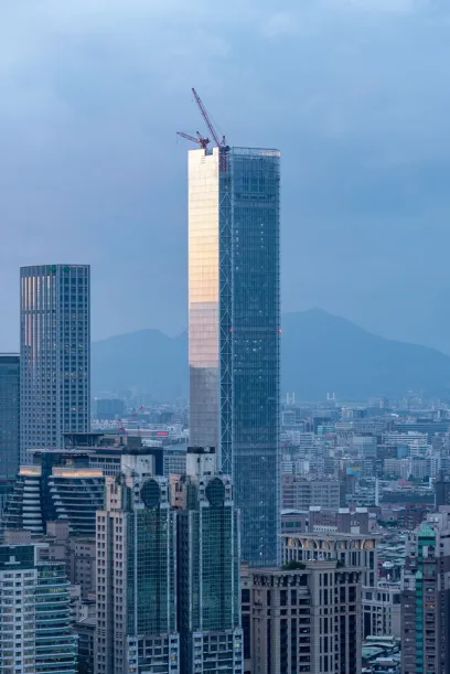 A city skyline with a very tall building in the middle