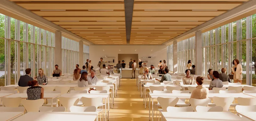 A modern, brightly lit dining hall with white tables and chairs, filled with diverse people.