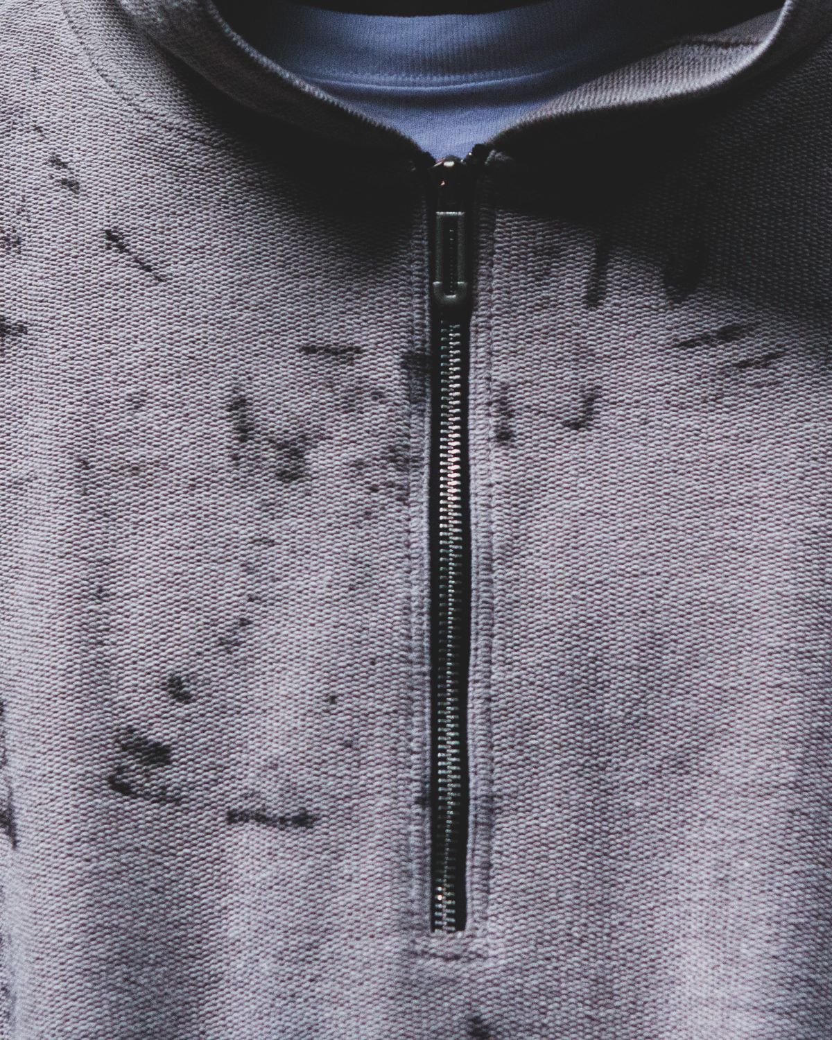The zip and the rust marks