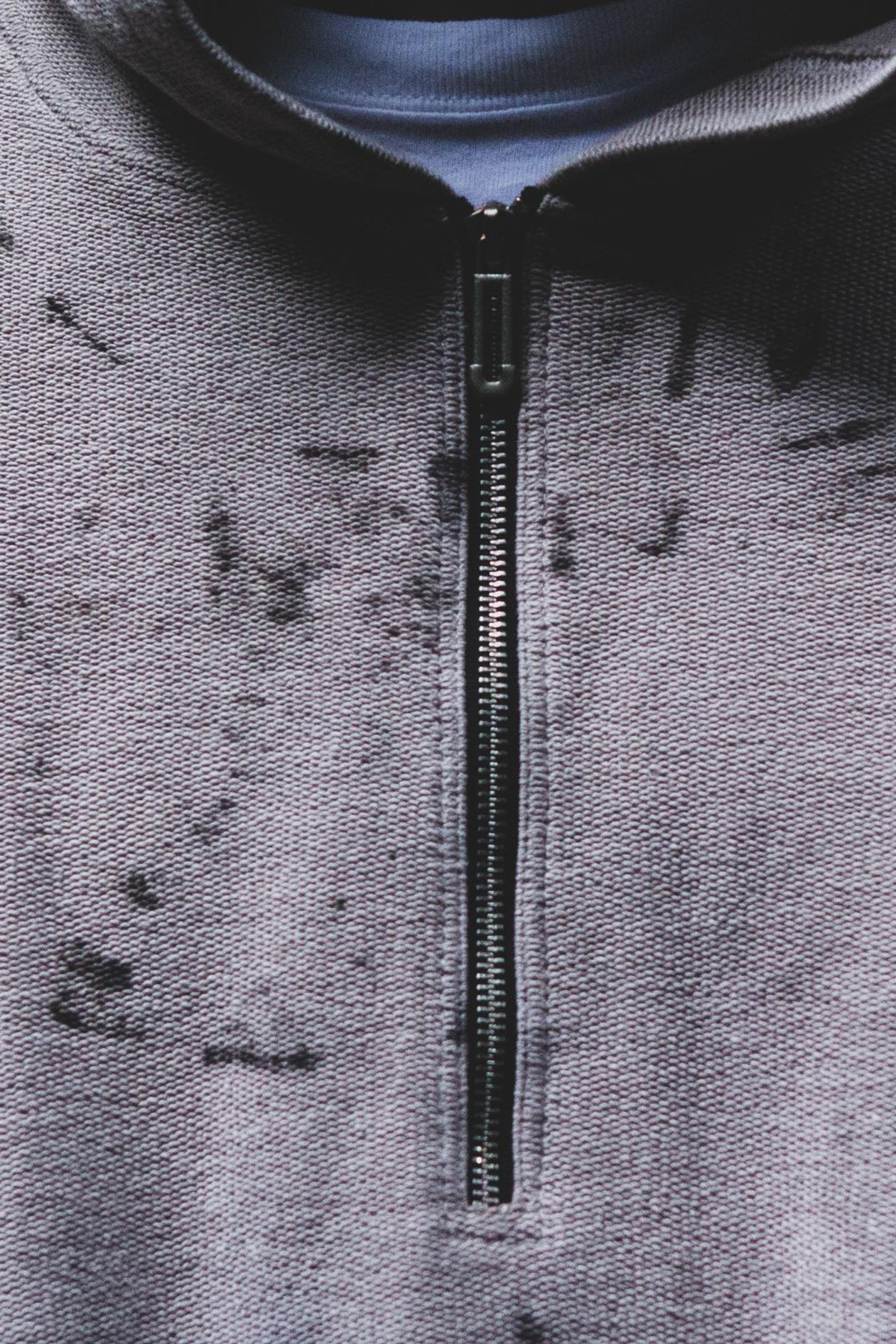 The zip and the rust marks