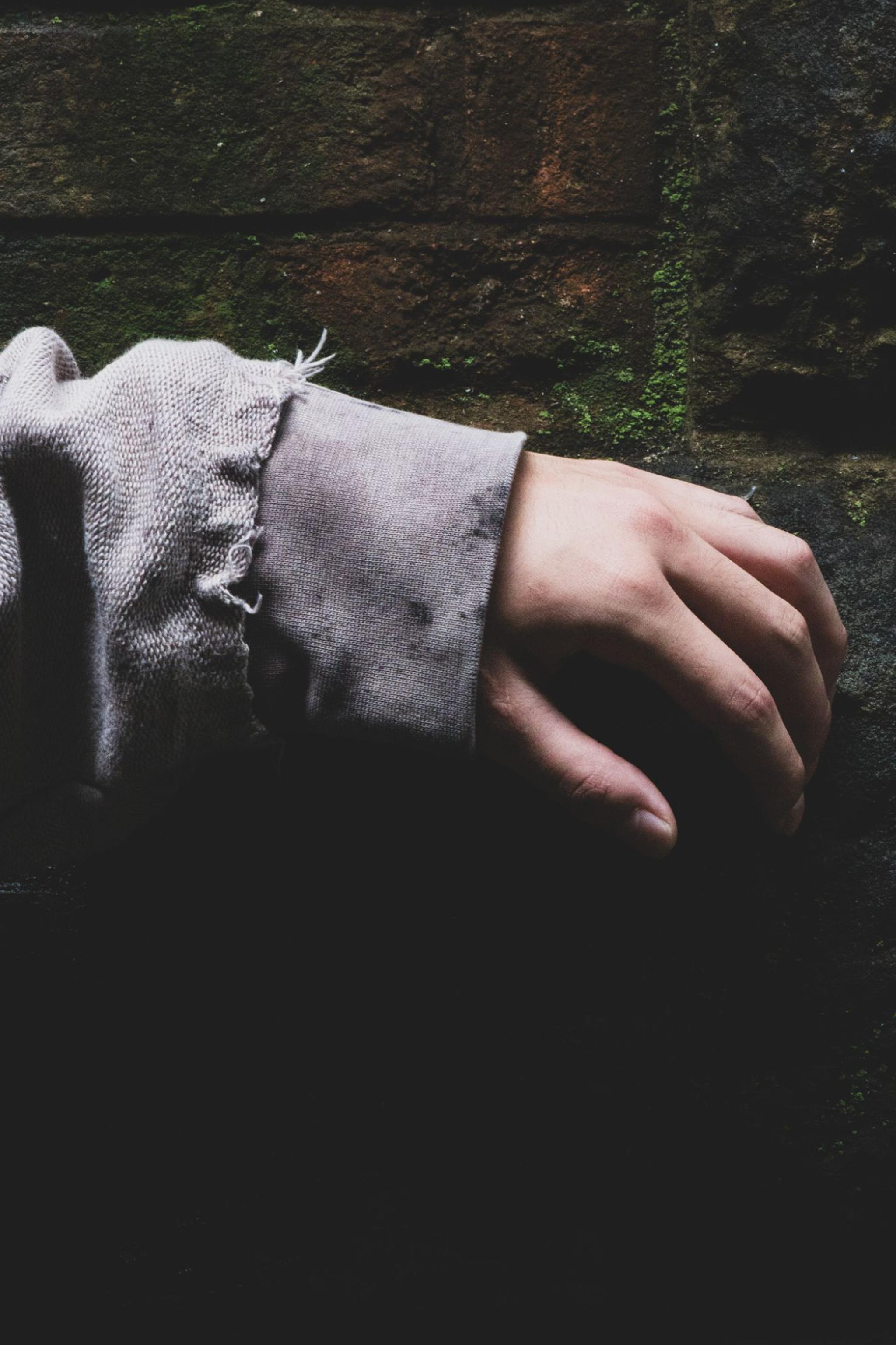 Cuff against a brick wall