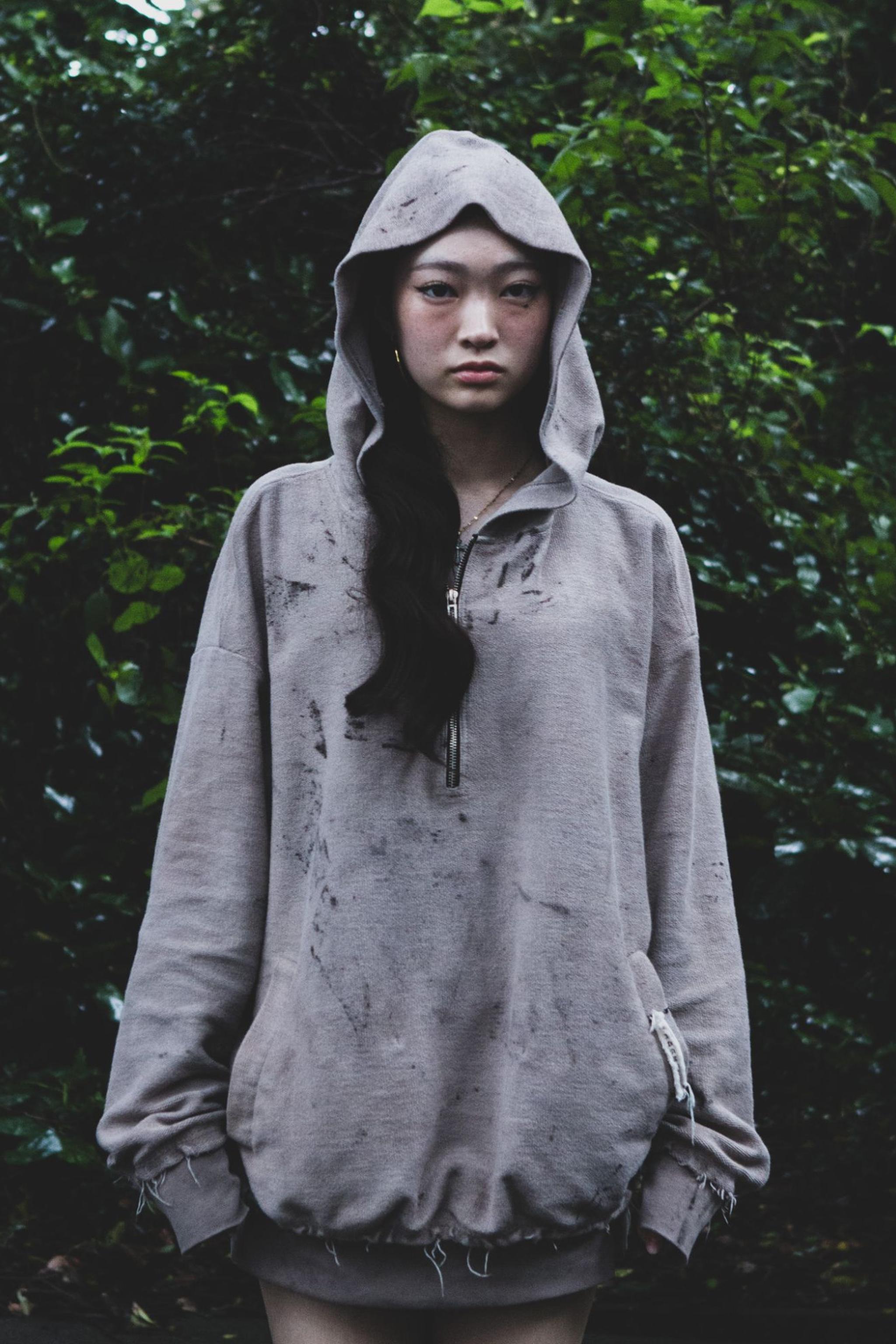 Front, hood up, in the forest