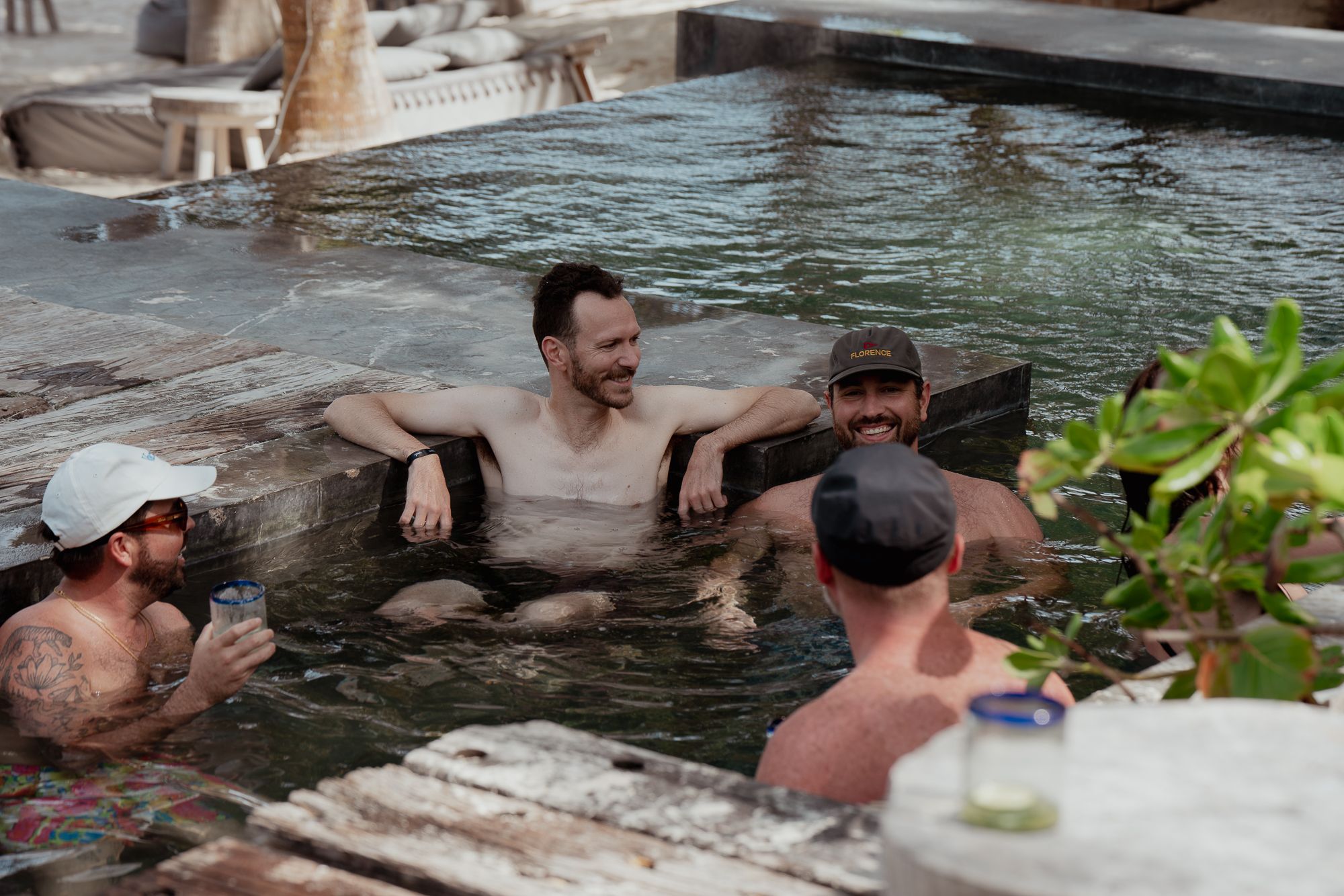 Someone team members chatting in the pool