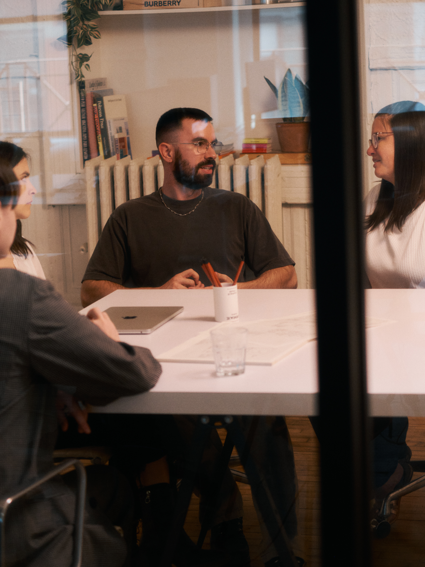Team members gathered around a conference table