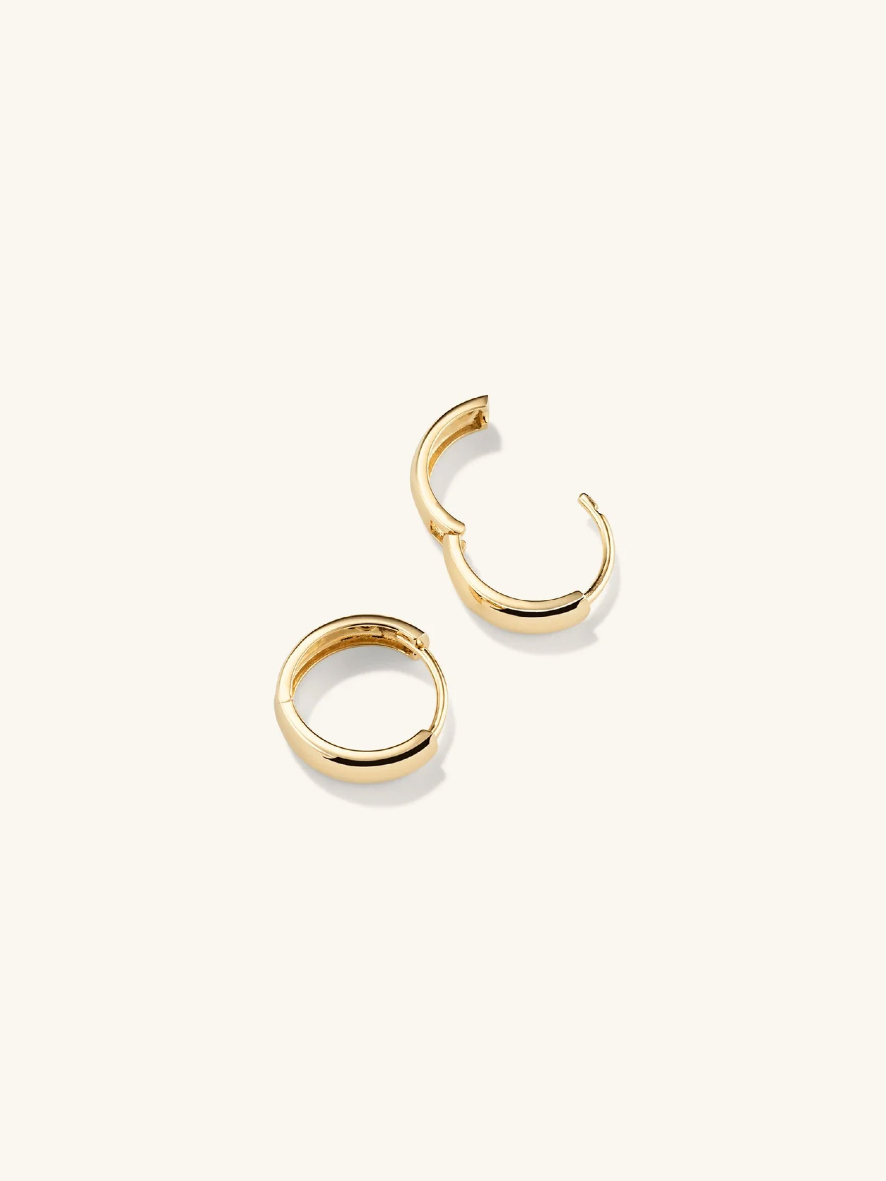 Ear rings on beige background