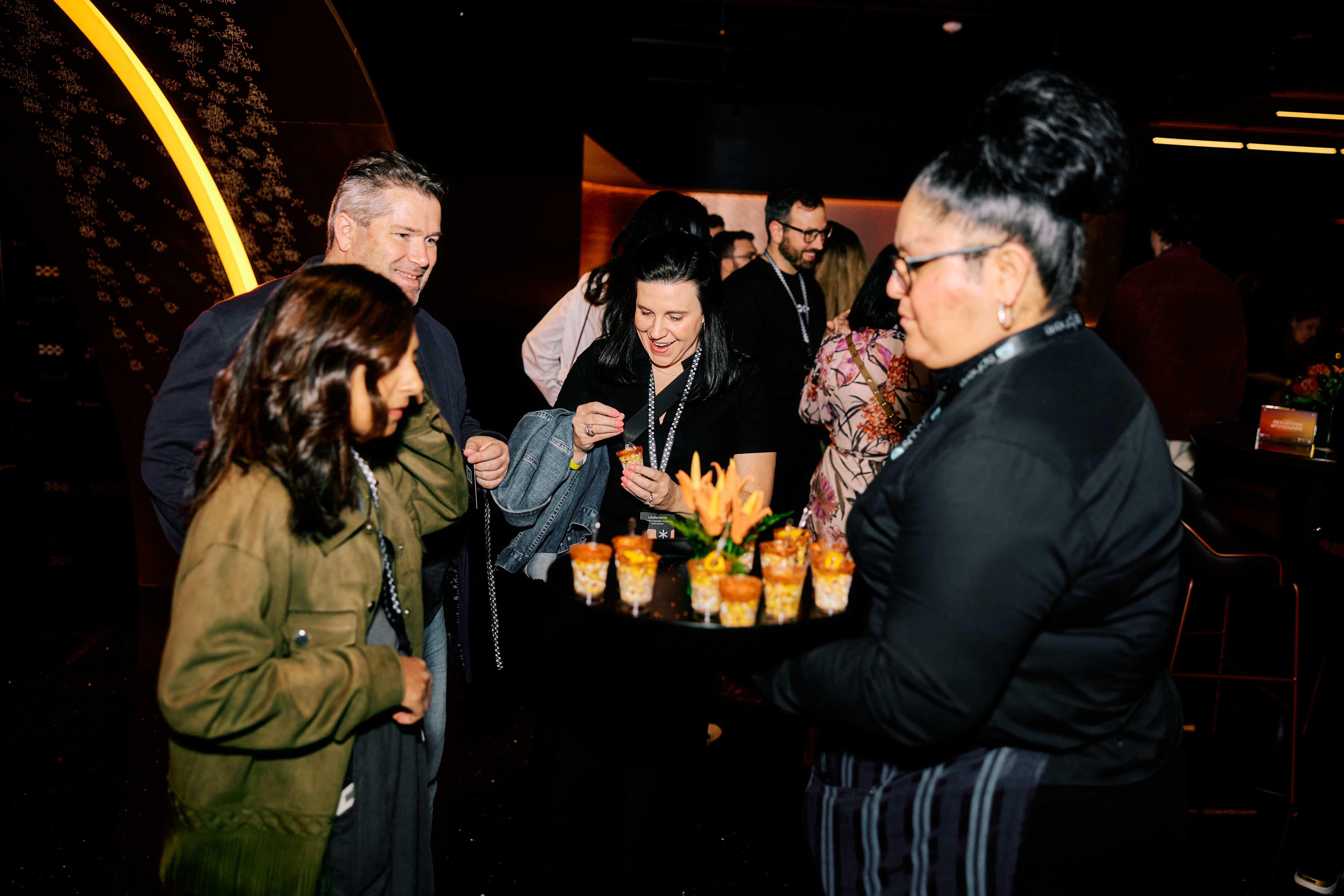 Guests eating appetizers at the event in the Theory Lounge at the Las Vegas Sphere