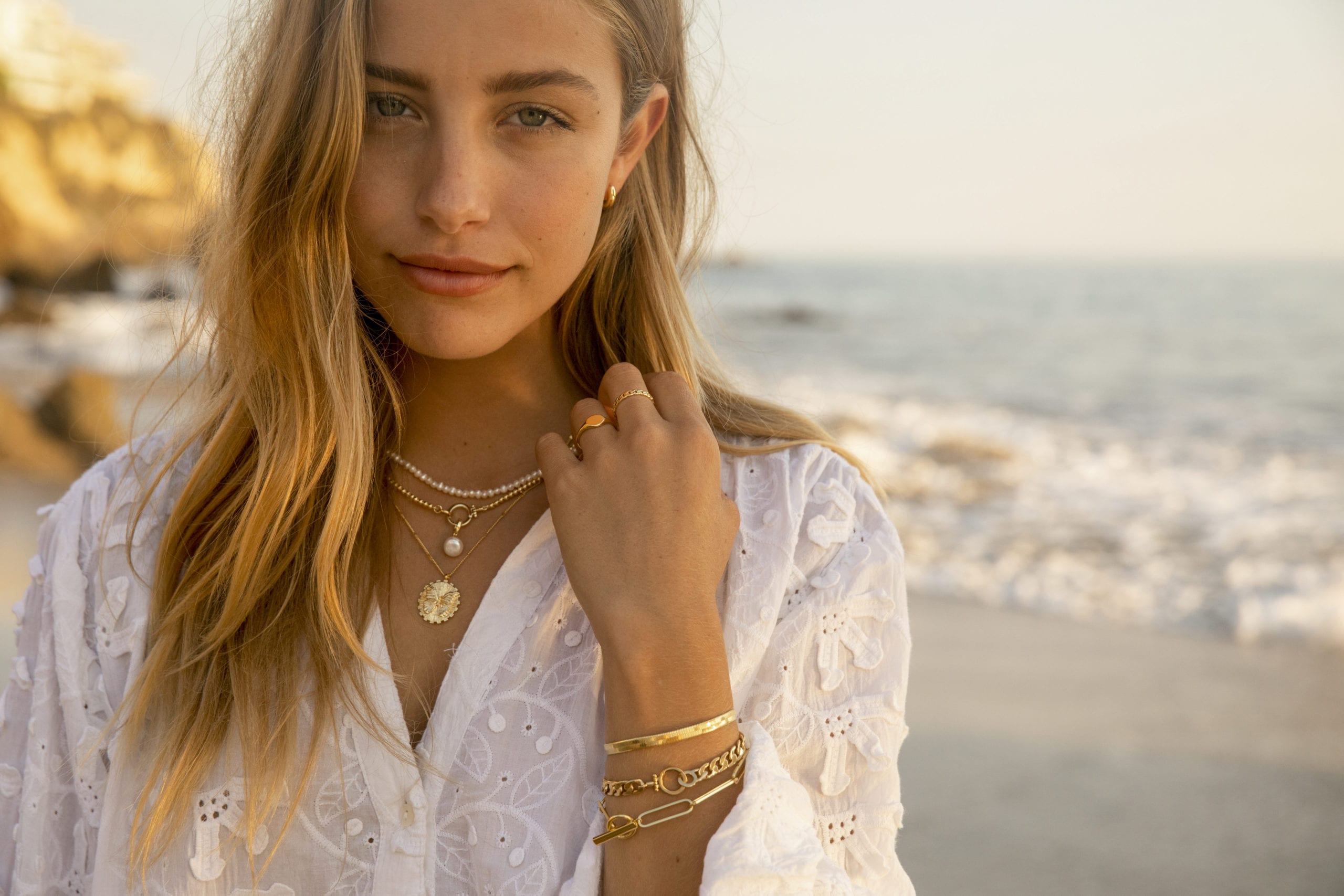 Lady on beach in jewellery 