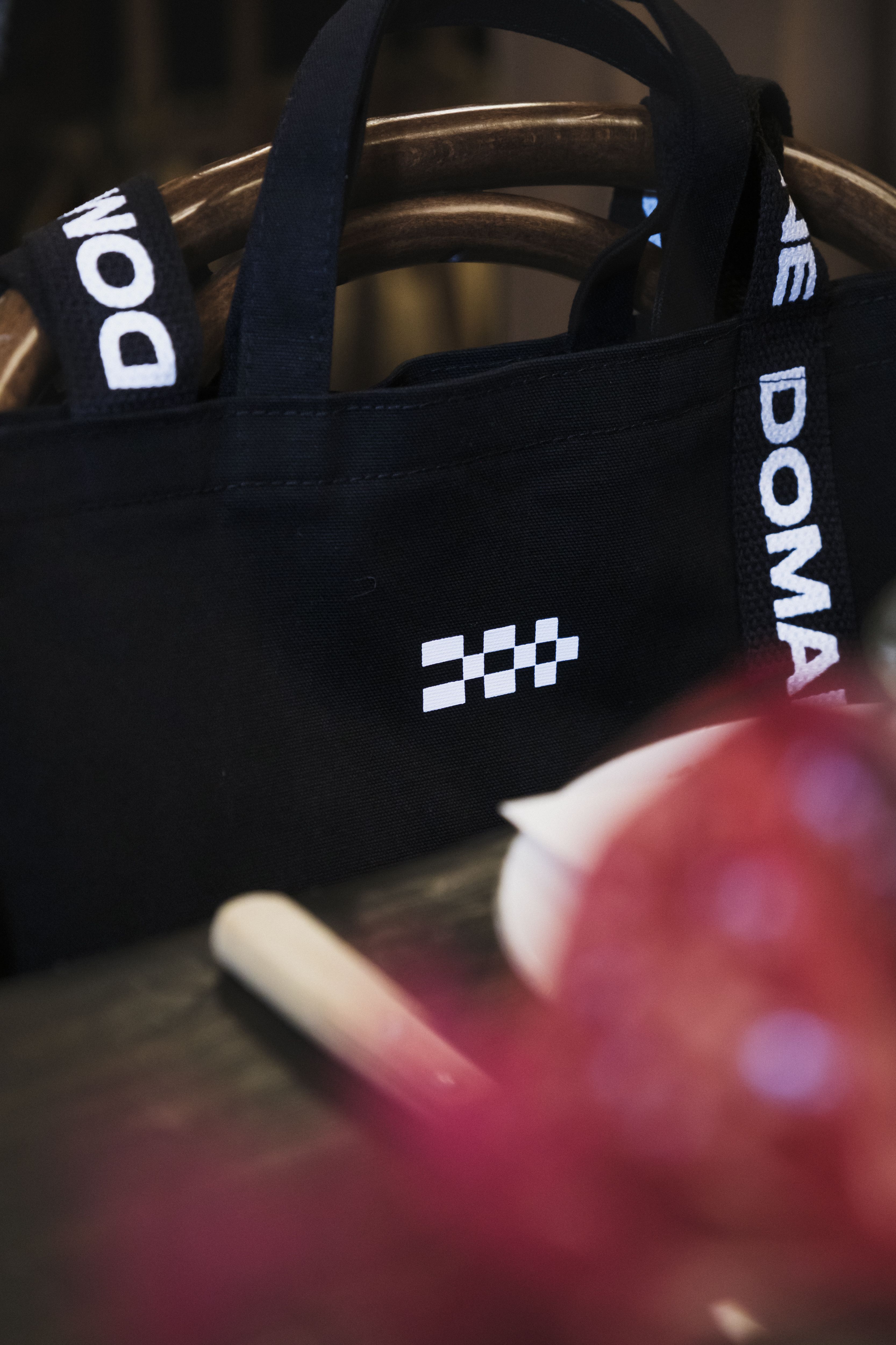 Someone totes with gifts at the Women in Ecommerce brunch