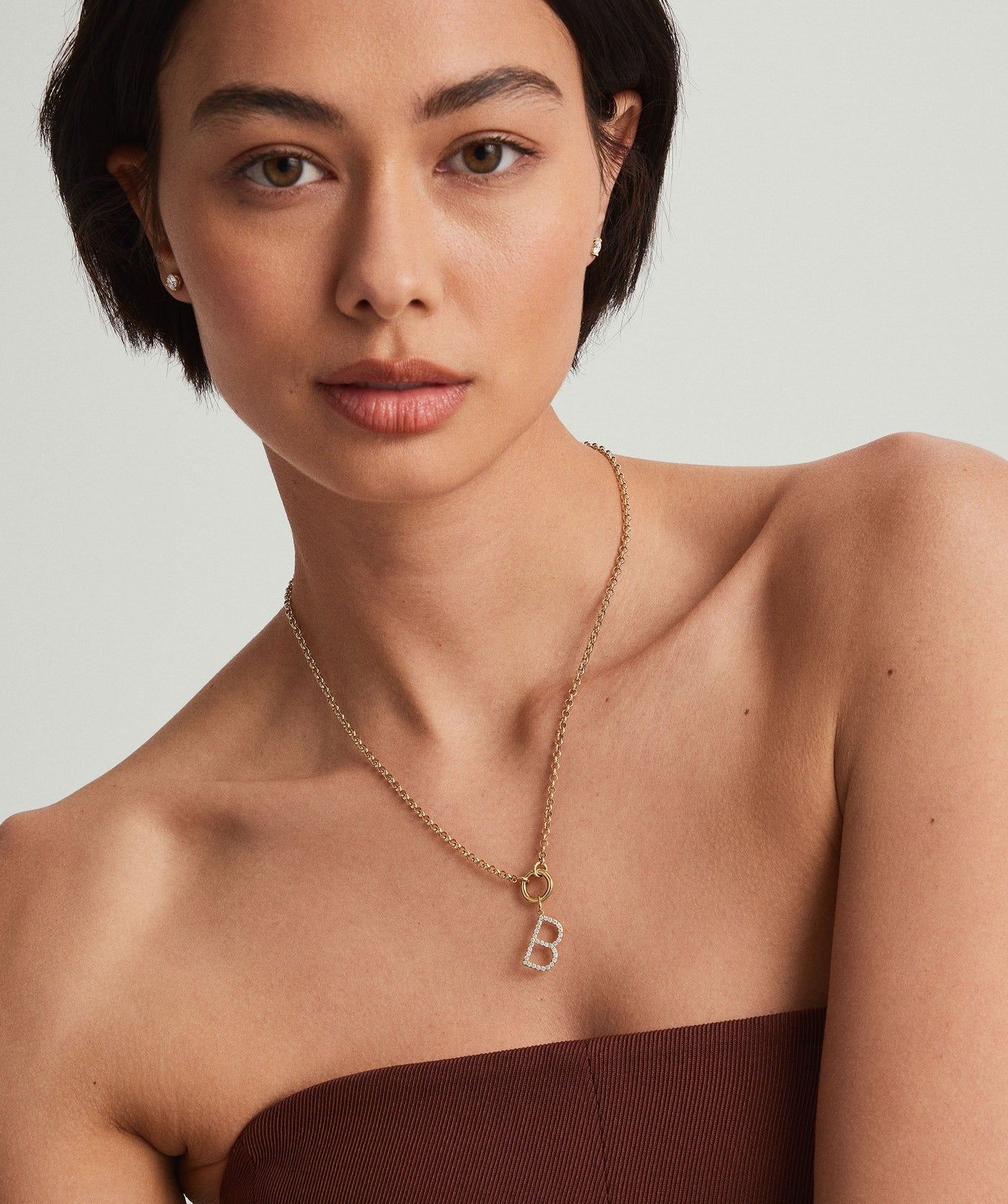 Model with B necklace