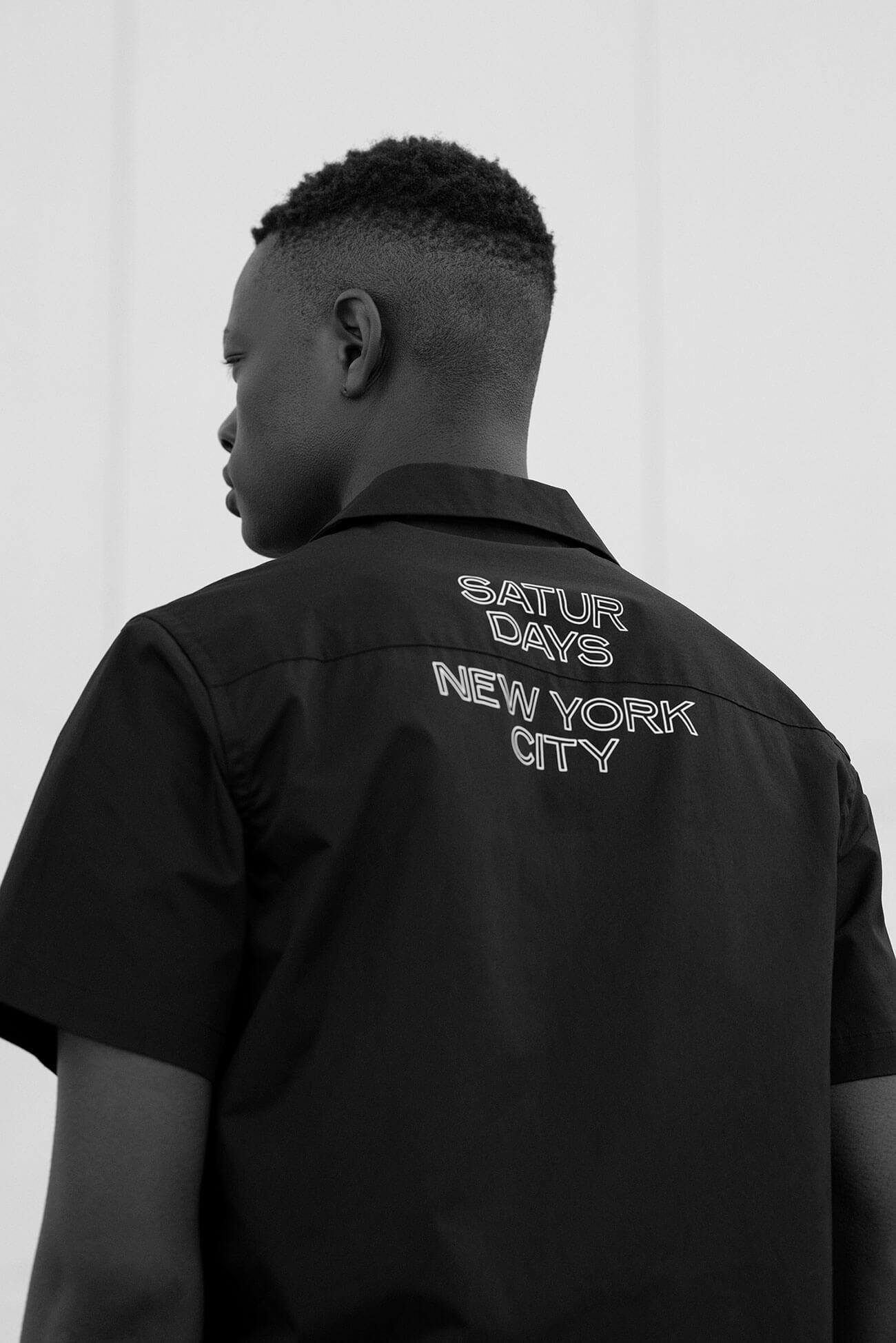 Man with his back turned wearing Saturdays shirt