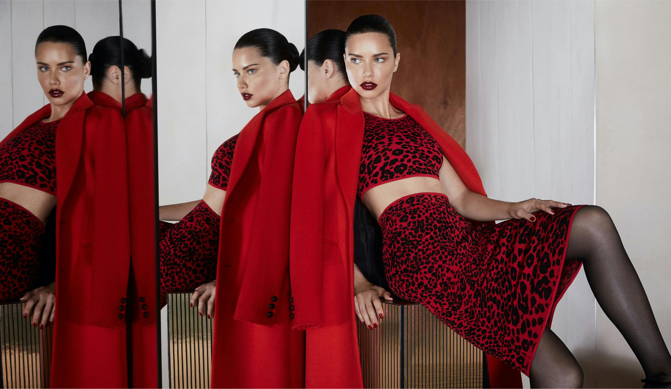 Model wearing BCBG outfit posing against mirrors