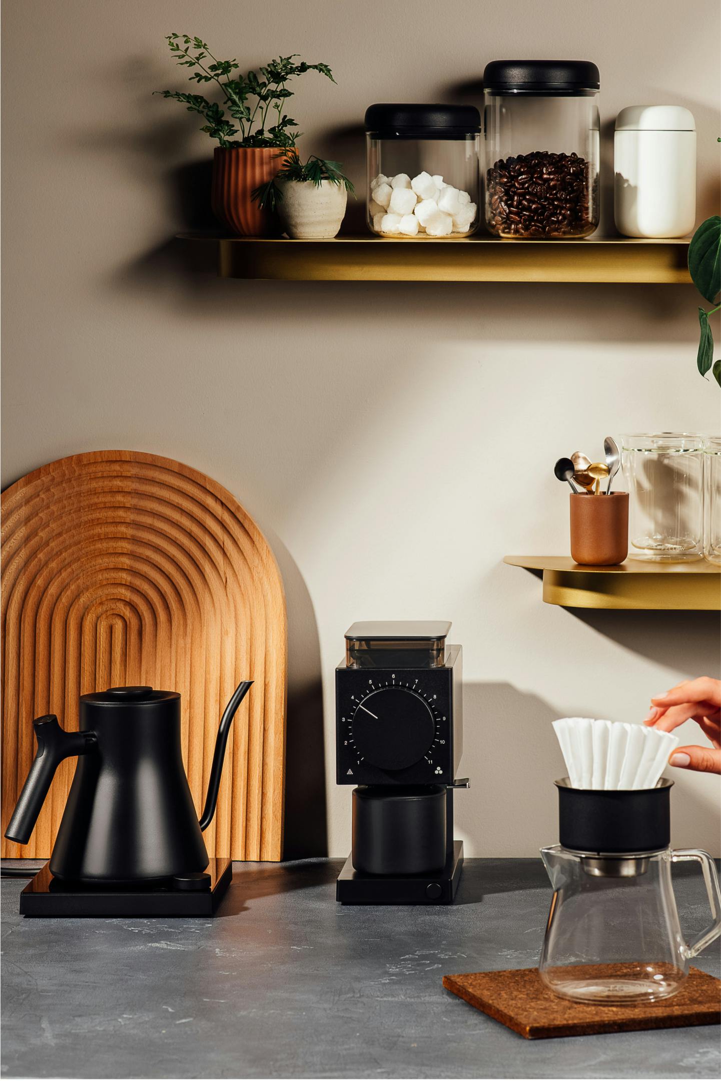 Various Fellow kettle, grinder, and pourover sitting on a countertop