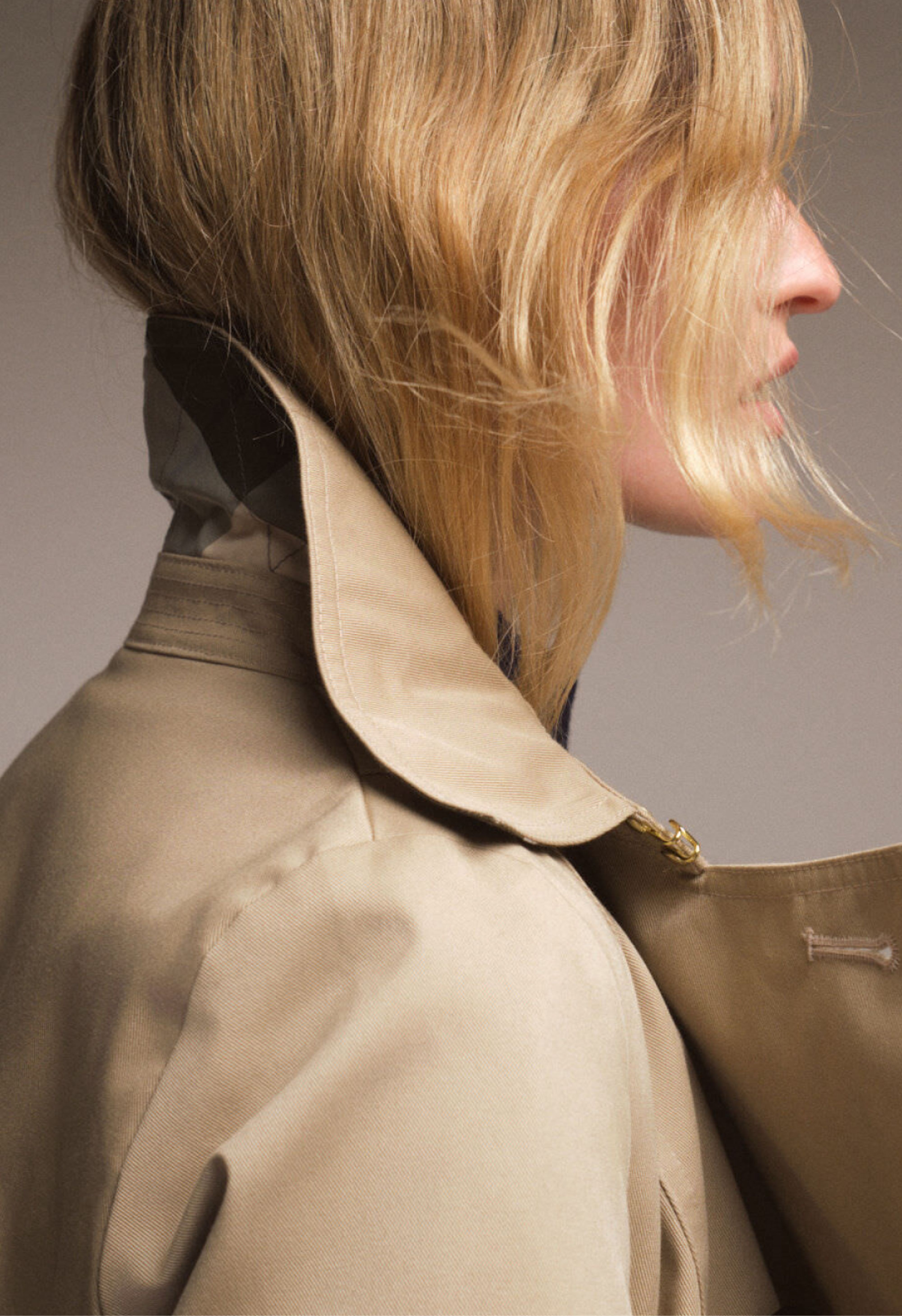 Image of a model in a trench coat from Tuckernuck website
