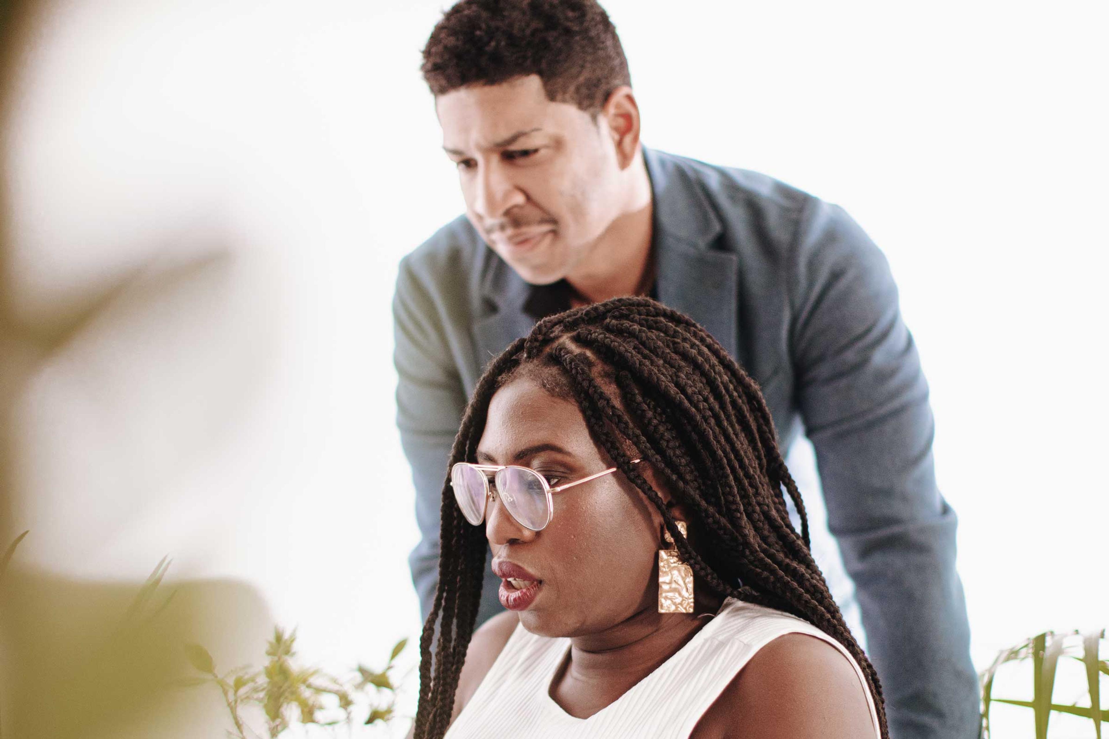 Brian and Joy working together in office.