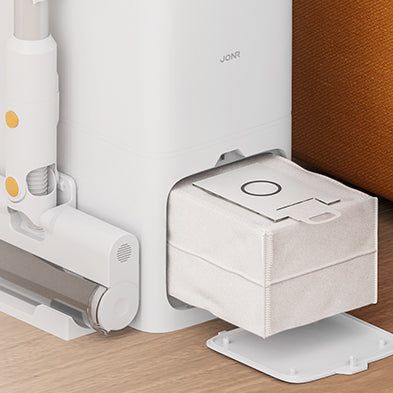 The JONR VC08 Pro docking station emptying the vacuum into its sealed dust bag.
