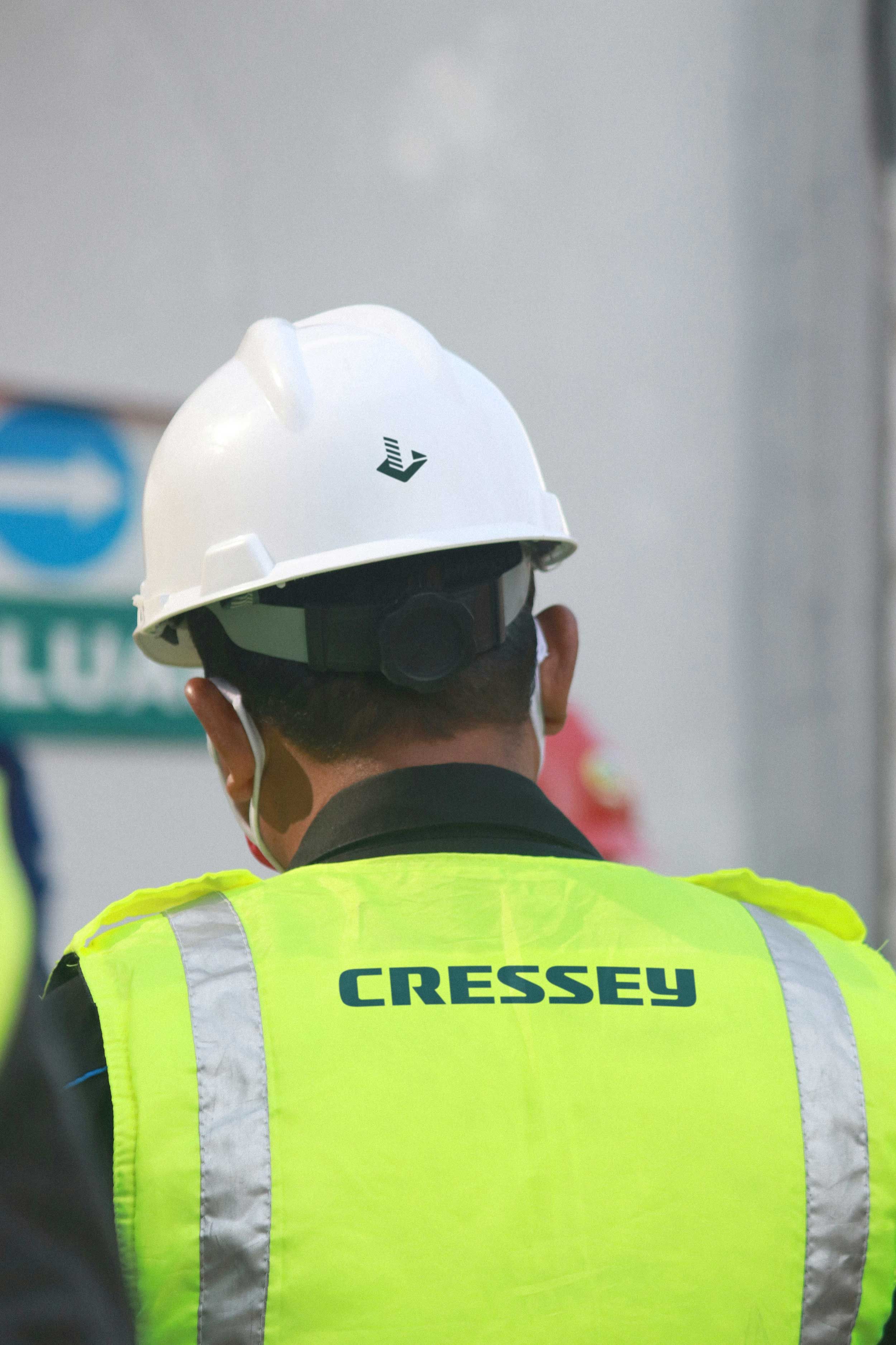 Cressey branded hard hat and hi-vis vest