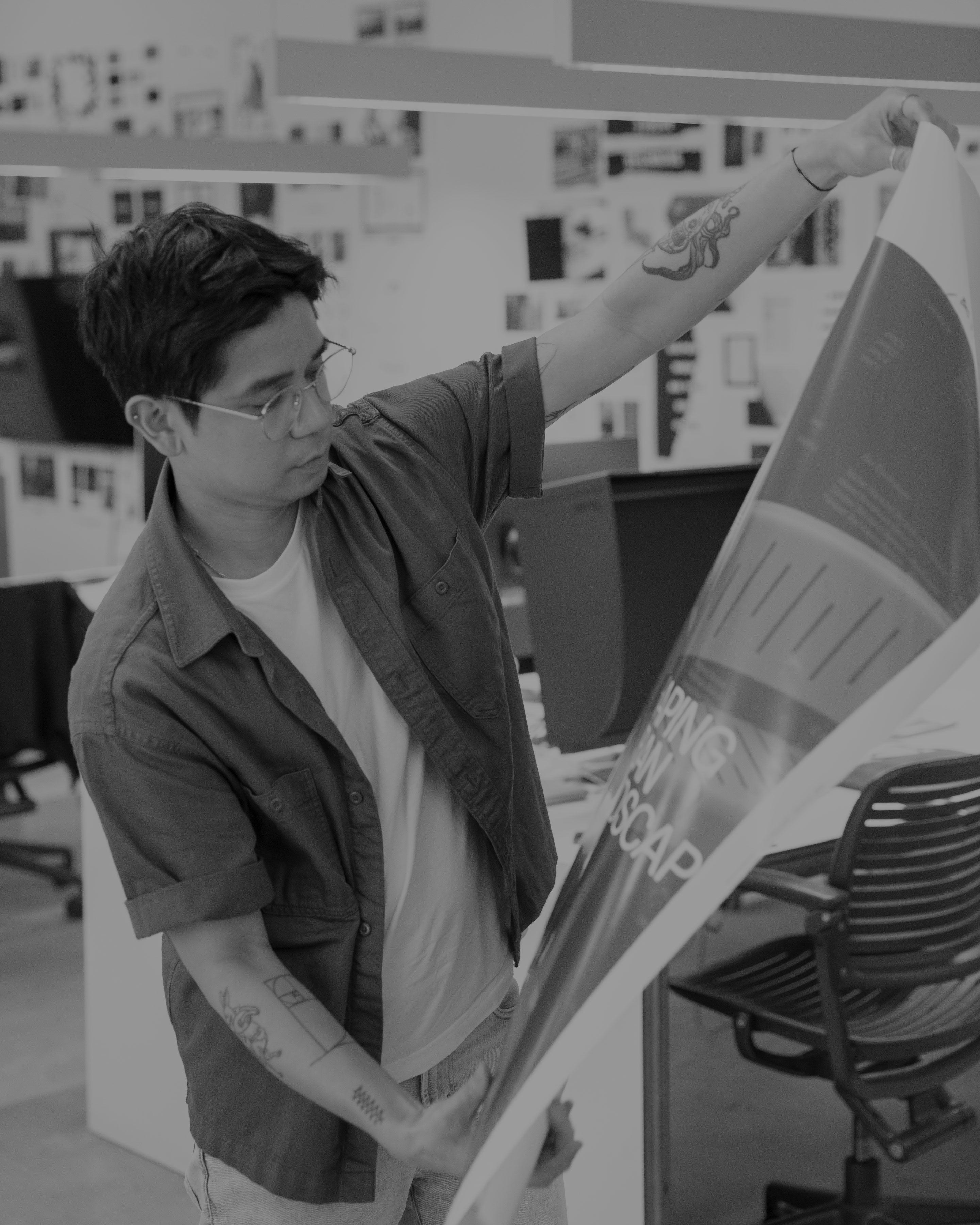 Design team member reviewing print project