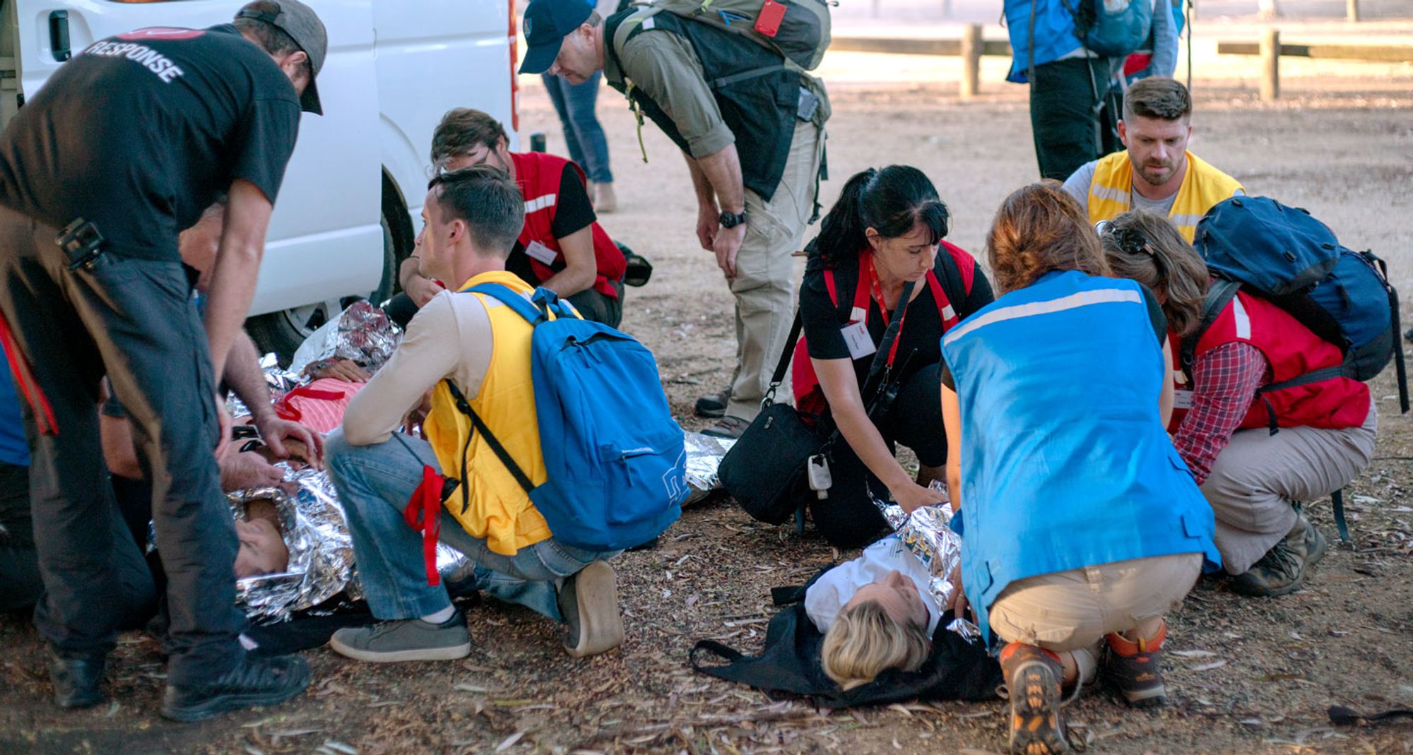 Training participants providing casualty care during a RedR Australia simulation exercise