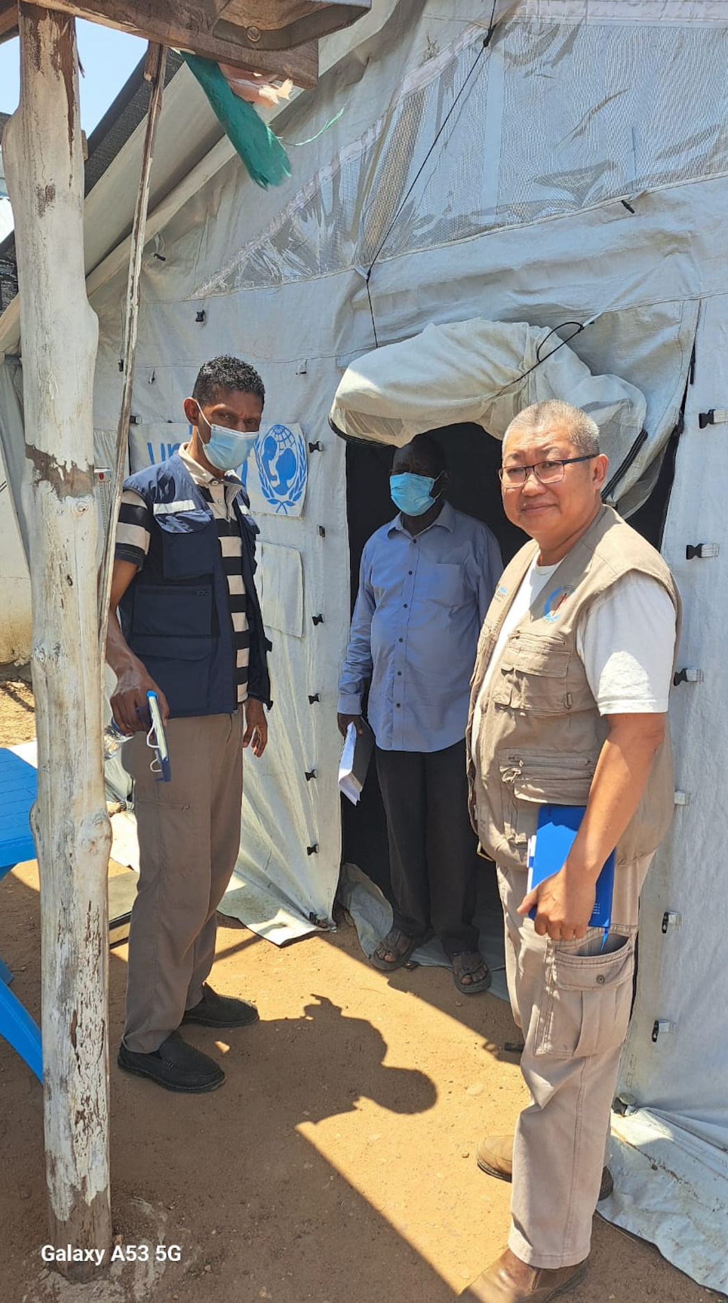 A RedR Australia specialist listening as a community member points out local conditions