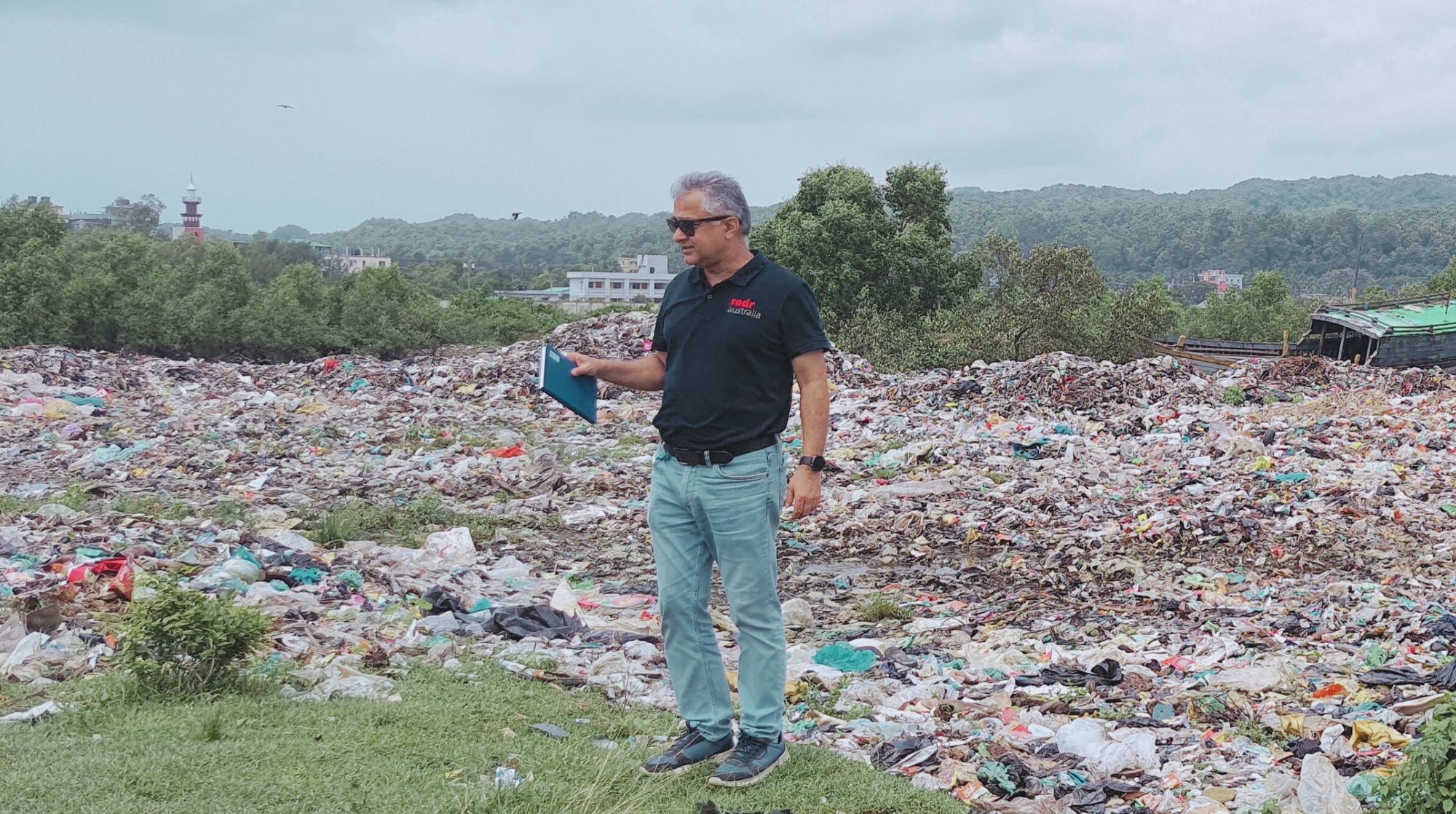 RedR Australia roster member Deepak inspects a waste-management site that requires support.