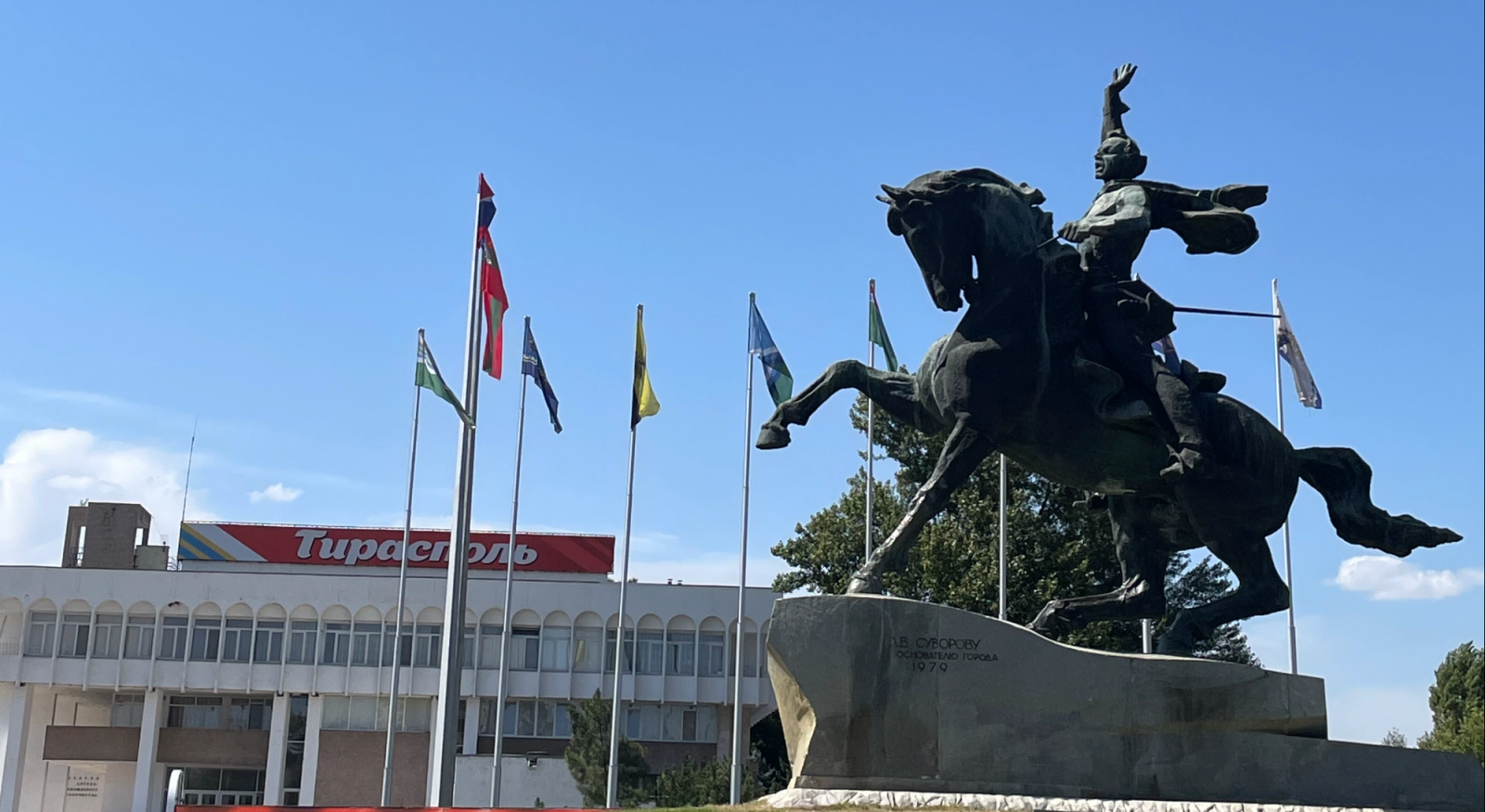 A statue of a man on a horse that is rearing into the air