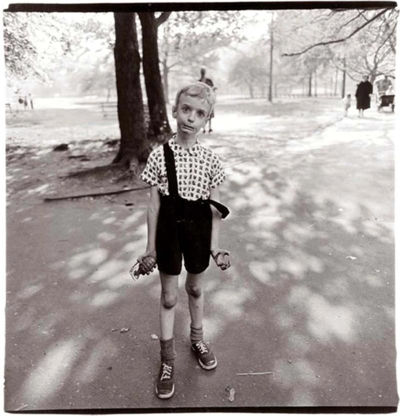 Exasperated boy with toy hand grenade, N.Y.C. [Child with a toy hand grenade in Central Park, N.Y.C.], 1962