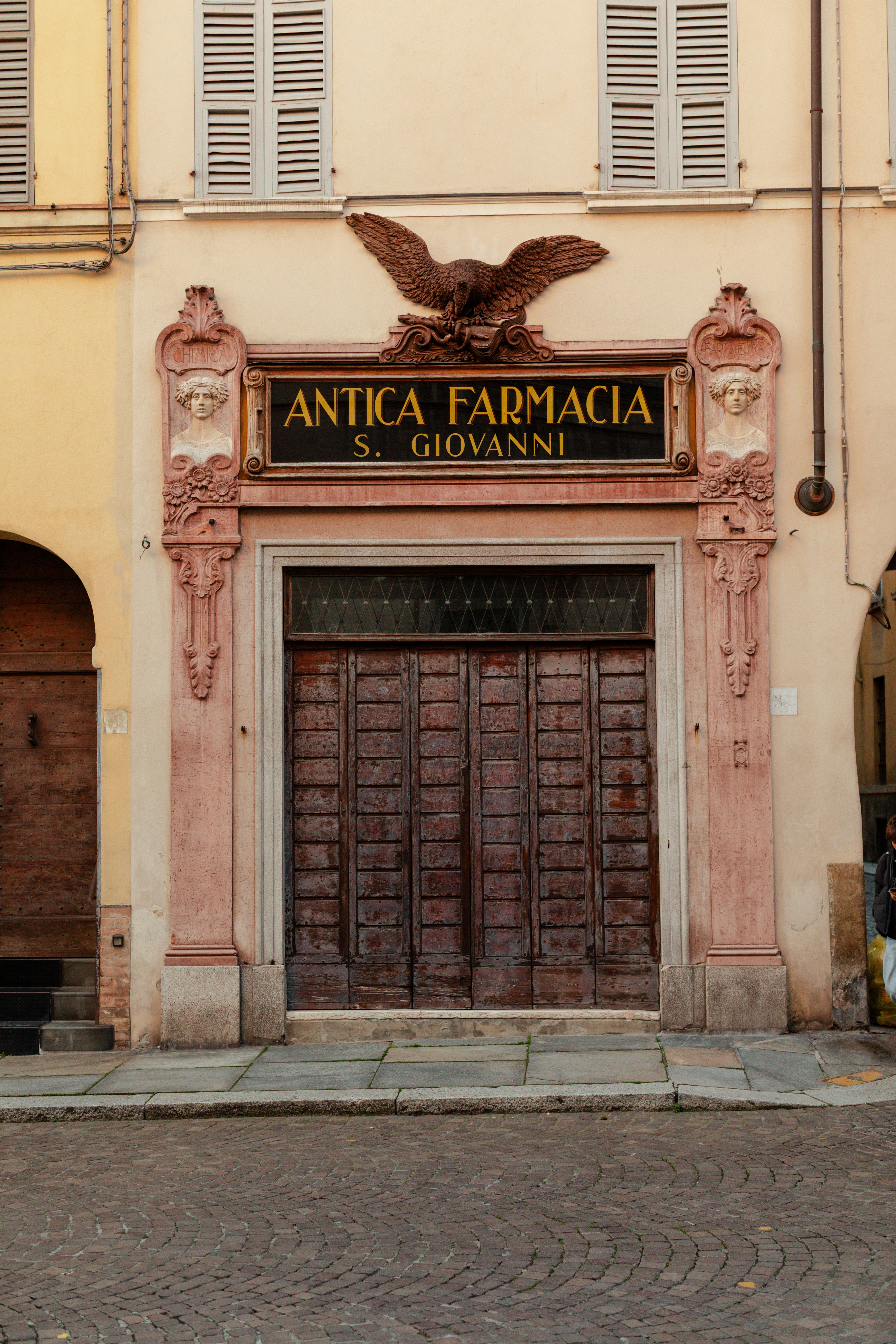 The historic facade of the Antica Farmacia San Giovanni in Parma