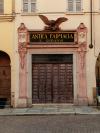 The historic facade of the Antica Farmacia San Giovanni in Parma
