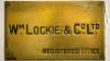 A weathered brass plaque engraved Wm Lockie & Co Ltd, Registered Office
