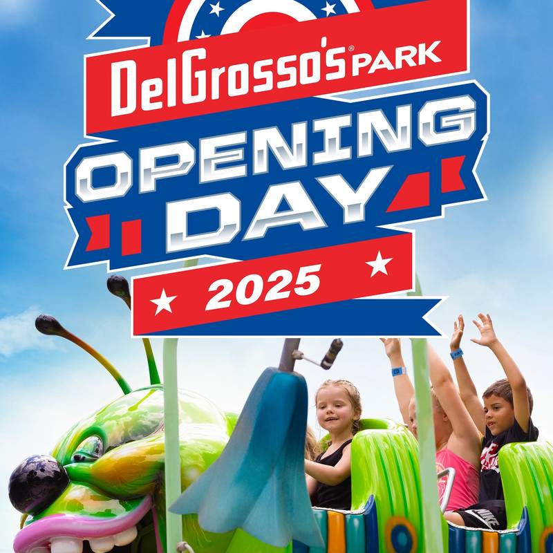 Wacky Worm ride with guests and sign reading Opening Day 2025