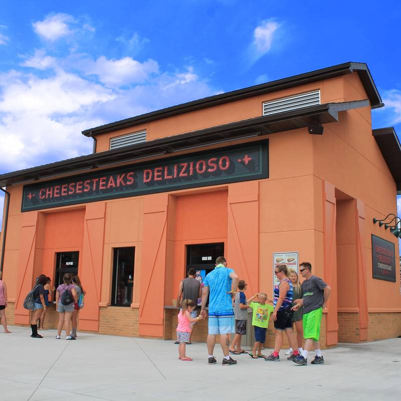Families in front of the Cheesesteaks Delizioso concession building
